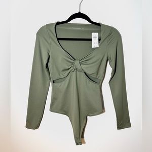 UNWORN Soft bodysuit with bow-like detail and cutouts